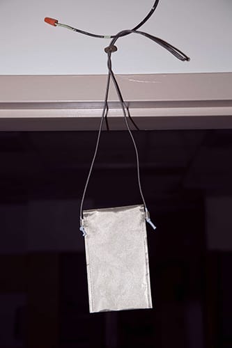 Faraday bag hanging from a wire in an open doorway
